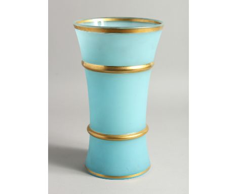 A LIGHT BLUE GLASS VASE with gilt band.