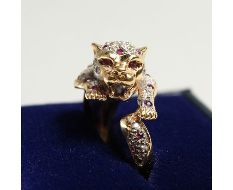 AN 18CT GOLD CARTIER DESIGN DIAMOND AND RUBY LEOPARD RING.