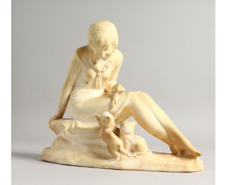 AN ART DECO MOULDED PLASTER MODEL OF A SEATED FEMALE FIGURE, two kittens by her side. 8.75ins high.