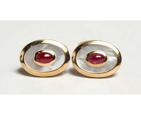 A PAIR OF 9CT. YELLOW GOLD, RUBY AND MOTHER OF PEARL OVAL CUFFLINKS