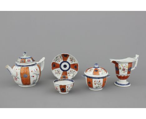 A set of Chinese porcelain tea wares, 18th C. Comprising a tea pot, a cup and saucer, a lidded sugar bowl and a helmet-shaped