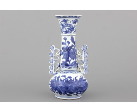 A Chinese porcelain blue and white Venetian glass style vase, Kangxi H: 20 cm. A small piece reglued on the top rim.