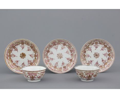 A pair of Chinese porcelain famille rose export cups and saucers, 18th C. Together with an extra saucer of the same service. 