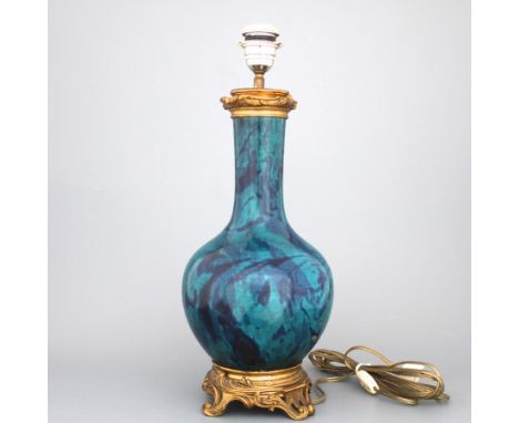 A turquoise and aubergine flambe bottle vase mounted as lamp, 19th C. H: 48 cm