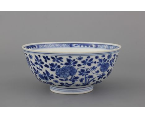 A Chinese porcelain blue and white bowl, Kangxi, 17th C. Dia: 15 cm, H: 7 cm. Condition: A crack in the base. Provenance: Ex-