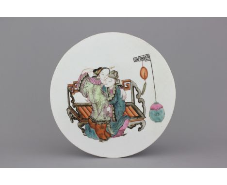 A Chinese porcelain famille rose round tile plaque with an erotical scene, 19th C. Dia: 33 cm
