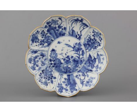 A Chinese porcelain blue and white lotus-shaped plate, Kangxi, ca. 1700 Condition: One very small chip. Dia: 23 cm