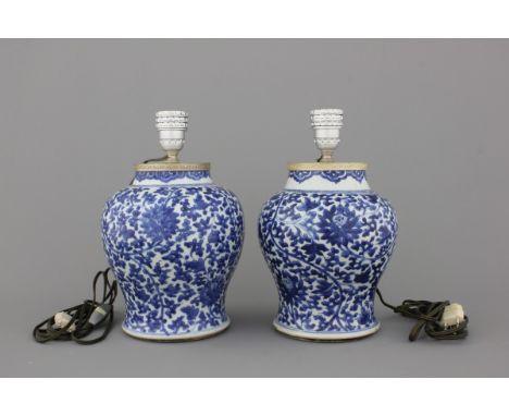 A pair of Chinese porcelain blue and white vases mounted as lamps, Kangxi, ca. 1700 H: 33 cm