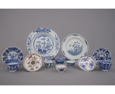 A collection of mostly blue and white Chinese porcelain plates, cups and saucers, 18/19th C. Including a Yongzheng cup and sa