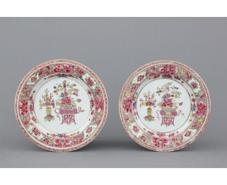 A pair of Chinese porcelain famille rose plates, Qianlong, 18th C. Dia: 23,5 cm Decorated with a vase and a basin on stand fi