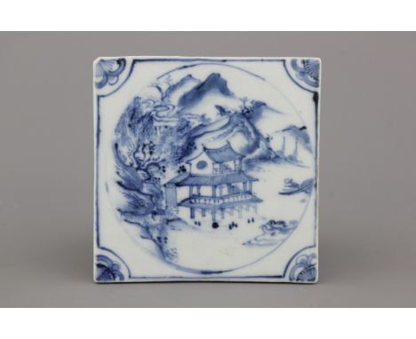 A Chinese porcelain blue and white tile with a landscape, 17/18th C. 15 x 15 cm