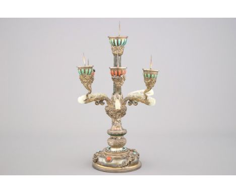 An impressive Chinese silver and jade candlestick, with turquoise and coral insets, 19th C. One of the jade belt hooks is bro