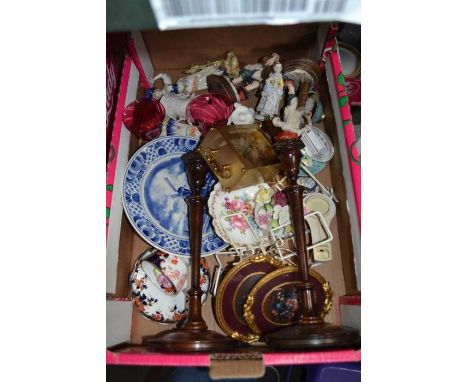 A box containing figurines, a pair of wooden candlesticks, mantle clock, etc