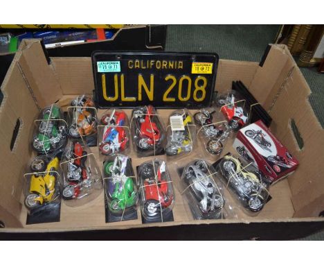 Thirteen Maisto die-cast models of Motor Racing mainly in mint condition, in original plastic display cases each with named p