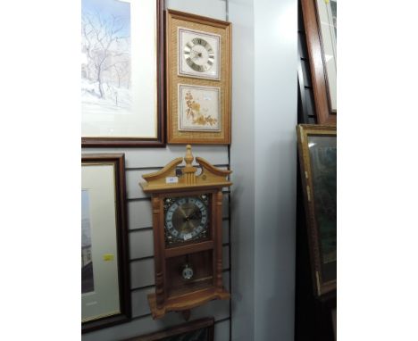 A pine wall clock by Daniel Dakota