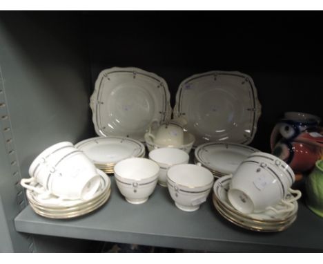 A part tea service by Paragon China with transfer print design