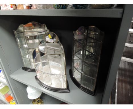 A selection of mirror backed and leaded light display shelves