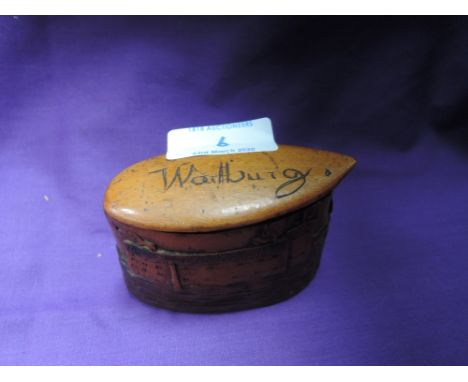 A box wood scrimshaw snuff or similar container marked Warlburg with carved port and town scene