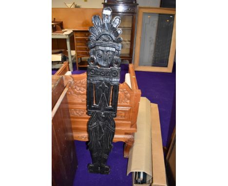 A vintage totem style wood panel