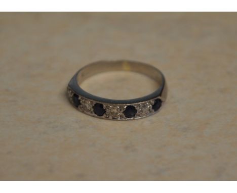 Tested as 18ct sapphire and diamond ring, approx 0.25ct of diamonds and 0.3ct of sapphires, approx weight 4g, Ring Size R