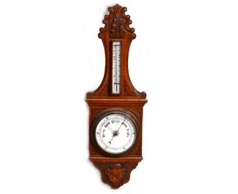 A Victorian carved oak case barometer, the thermometer with Fahrenheit and centigrade scales, circular pressure chart, 92cm.