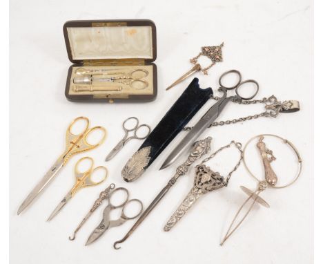 A French cased sewing set by Tahan and other sewing items., the case containing gold-plated scissors, needle case, thimble et