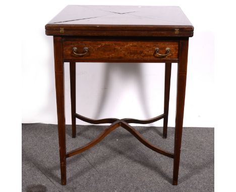 An Edwardian mahogany envelope-top card table, frieze drawer, on tapered square legs, ‘X' stretchers, width 56cm, height 71cm