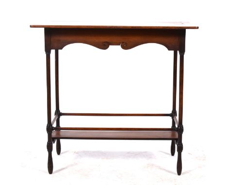 A Victorian mahogany occasional table, rectangular top, shaped apron, raised on turned supports joined by stretchers and a na