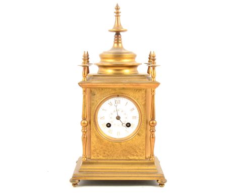 Victorian gilt brass mantel clock with slender vase finials, column angles, floral bright cut mask to 5cm, white Roman dial, 