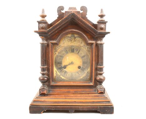 Victorian oak case mantel clock, architectural case, gilt dial with cherubim arch, floral spandrels, the movement striking on
