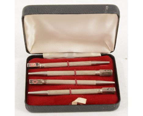A cased set of silver bridge pencils, engine turned design, 8.5cm, marked Sterling silver.