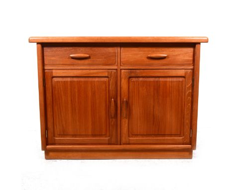 A Dyrlund teak sideboard, 1980s, with two short drawers above pair of cupboards with adjustable shelves, inset gilt button la