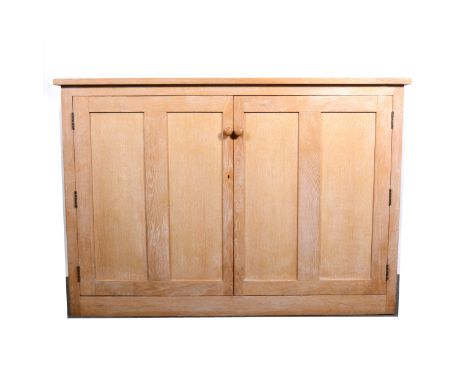 A limed oak two-door linen cupboard, rectangular top and two panelled doors, enclosing a fixed shelf, plinth base, length 166