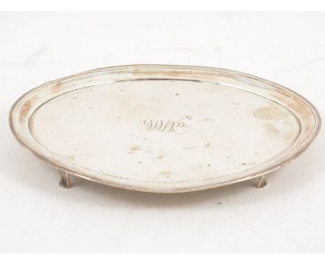 A George III silver teapot stand by Peter and Ann Bateman, London 1796, oval form with reeded edge, four fluted legs, engrave