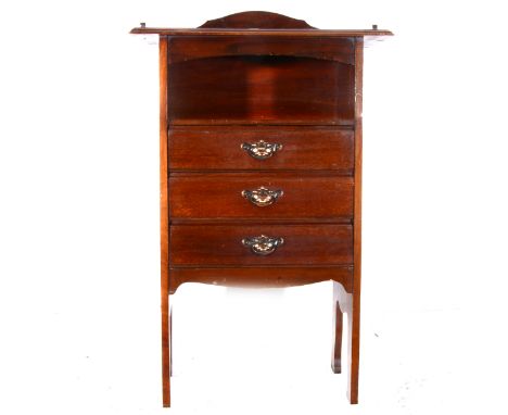 An Edwardian mahogany music cabinet, three-quarter shallow gallery to the moulded top, open arched frieze shelf with three dr