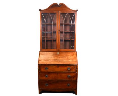 Early 19th Century mahogany bureau bookcase, upper section with swan neck pediment, pair of astragal glazed doors enclosing t