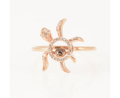 A diamond set "Floating Turtle" ring, a chocolate coloured diamond claw set on a tremble to the centre of a rose metal model 