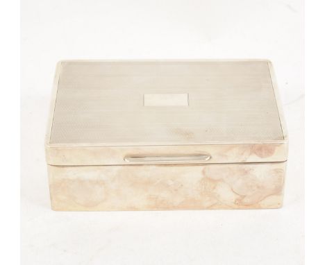 A silver cigarette/jewel box by James Deakin &amp; Son, Chester 1931, engine turned cover with vacant initial plate, plain po