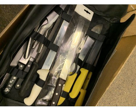 Victorinox knife wrap complete with three Victorinox knives, scissors, and five Global knives. Estimate £30-40.
