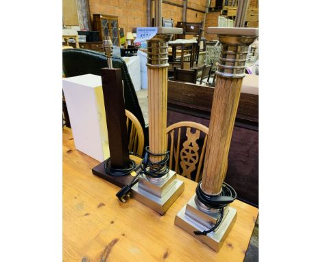 Pair of columned table lamps, height 66cms; together with a wooden lamp and shade, height of lamp 53cms.  Estimate £20-30.