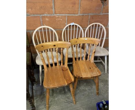 3 light coloured Windsor chairs and 2 pine rail back chairs. Estimate £10-20.