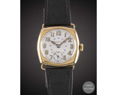 A GENTLEMAN'S 18K SOLID GOLD ZENITH "CUSHION" WRIST WATCH
CIRCA 1920, WITH BLUE 24 HOUR WHITE PORCELAIN DIAL &amp; CATHEDRAL 