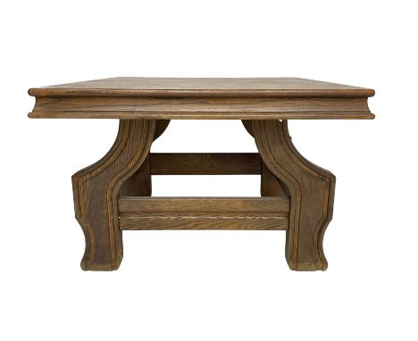 Square oak coffee table on shaped moulded baseDimensions: Height:&nbsp;54cm&nbsp; Length/Width:&nbsp;79cm&nbsp; Depth/Diamete