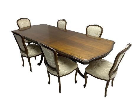 French inlaid walnut extending twin pedestal dining table, rectangular top with canted corners and crossbanding, inlaid with 