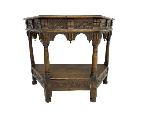 Jacobean design carved oak side or credence table, demi-heptagon top with moulded edge, frieze carved with foliate C-scroll d