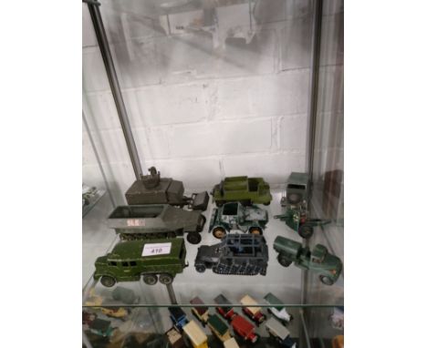 Shelf of dinky , corgi playworn amoured vehicles etc. 