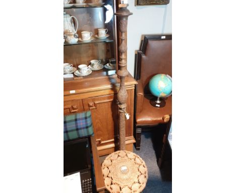 Oriental carved floor lamp together with carved table . 