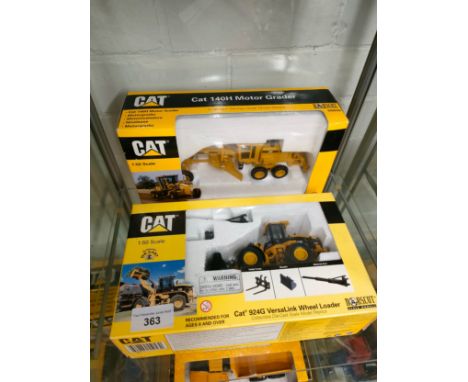 2 Boxed Cat vehicles includes tractor . 