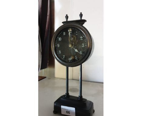 Unusual  Mantel clock with pendulum inside face of clock. 