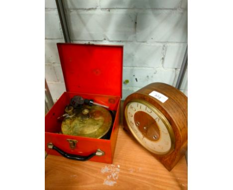 Art Deco mantle clock together with vintage brass stove. 